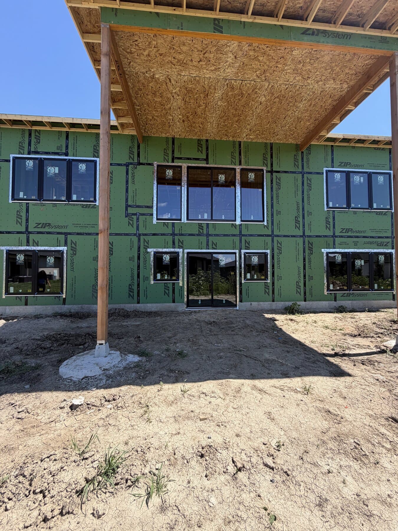 Covered porch framing with exposed timber posts