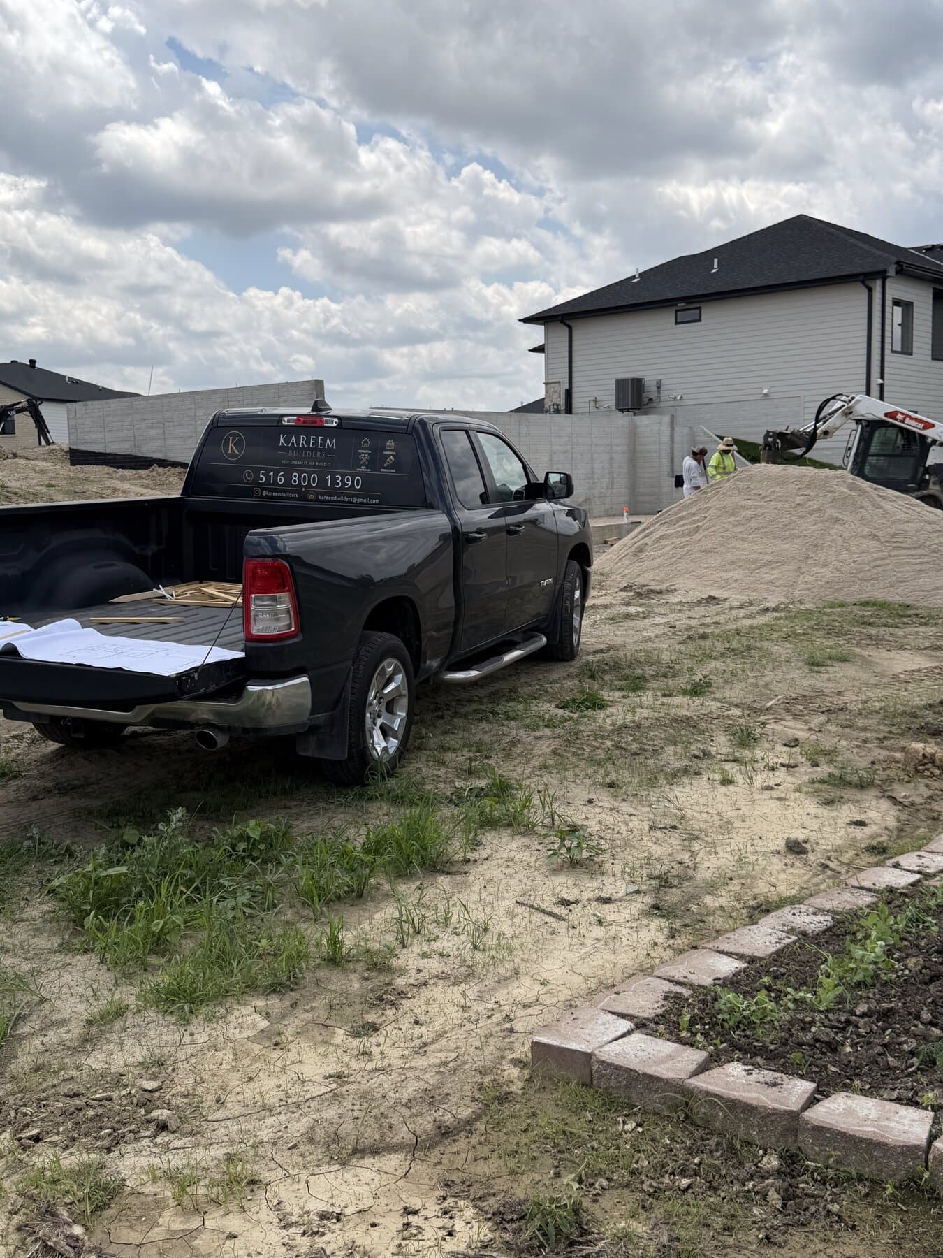 Kareem Builders truck and crew on an active job site