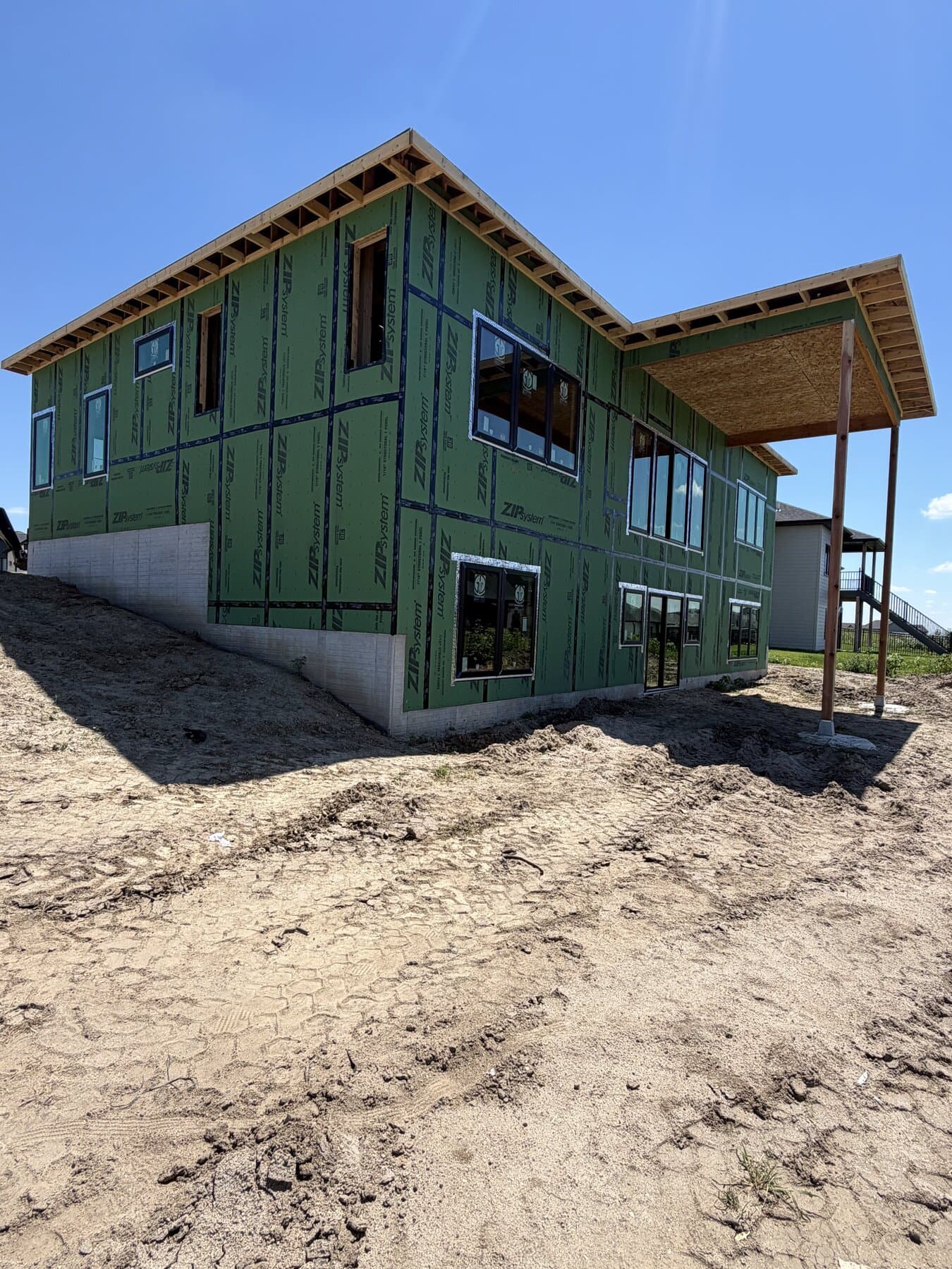 Home fully wrapped in weatherproof sheathing